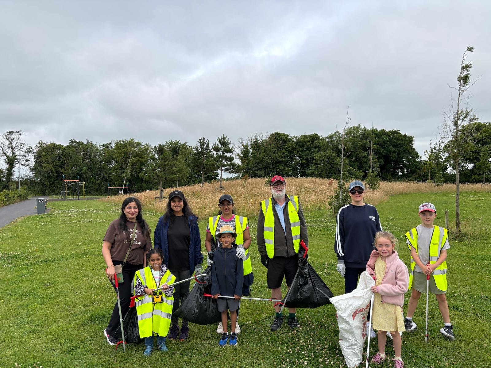 Volunteers of all ages by the Westmill green