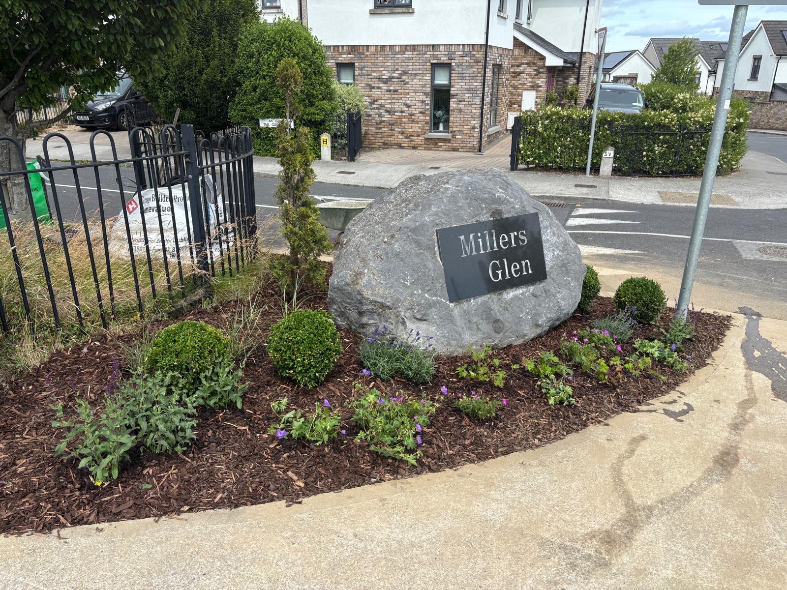 The finished entrance — fresh, planted and welcoming
