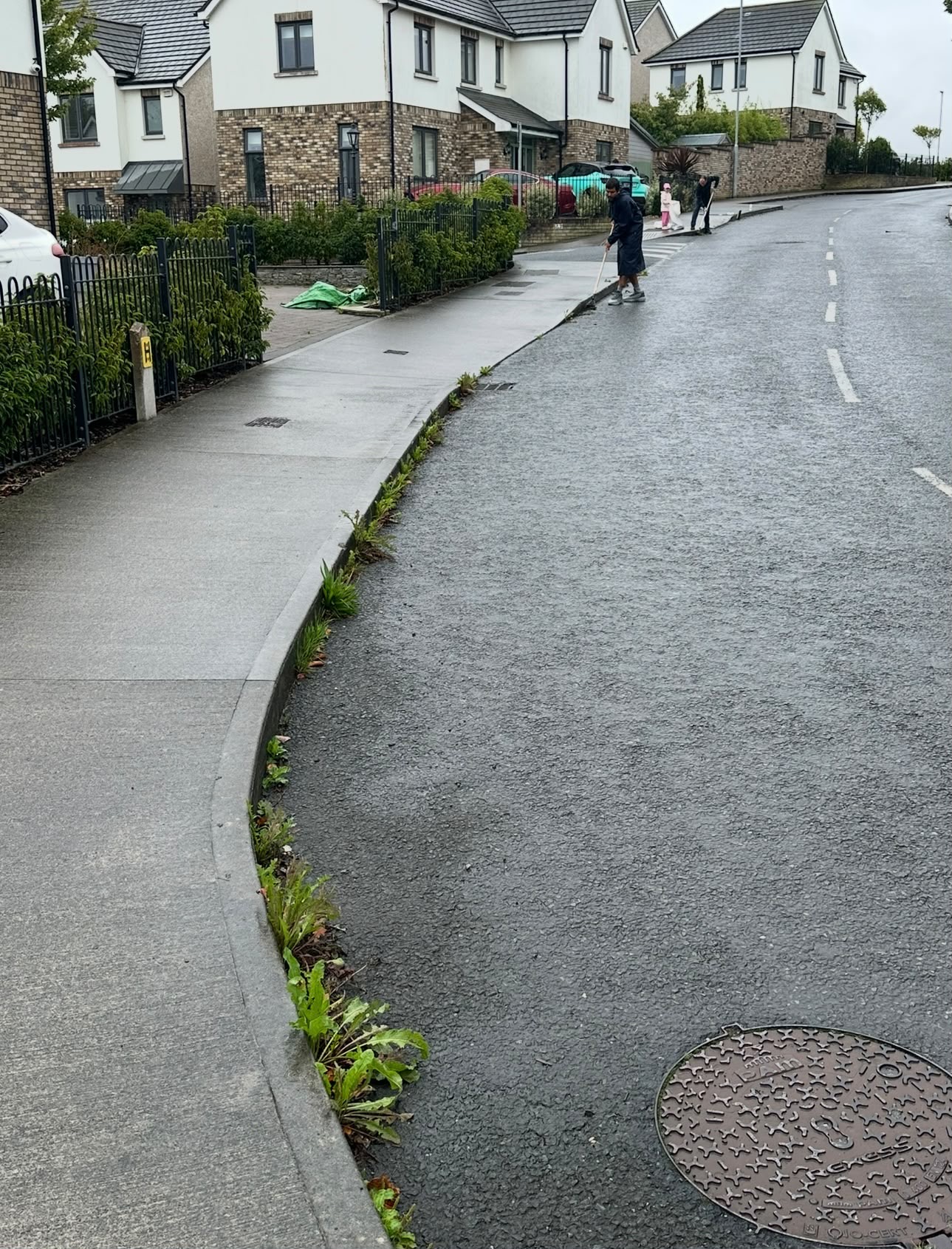 Sweeping the road on a wet morning